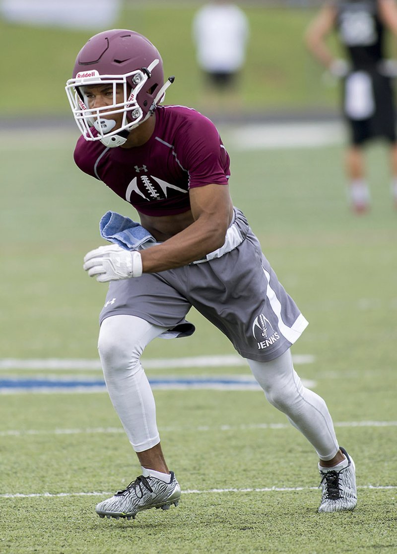 Jordon Curtis, Jenks (Okla.) High tailback/defensive back, plays Friday during their game against Elkins High.