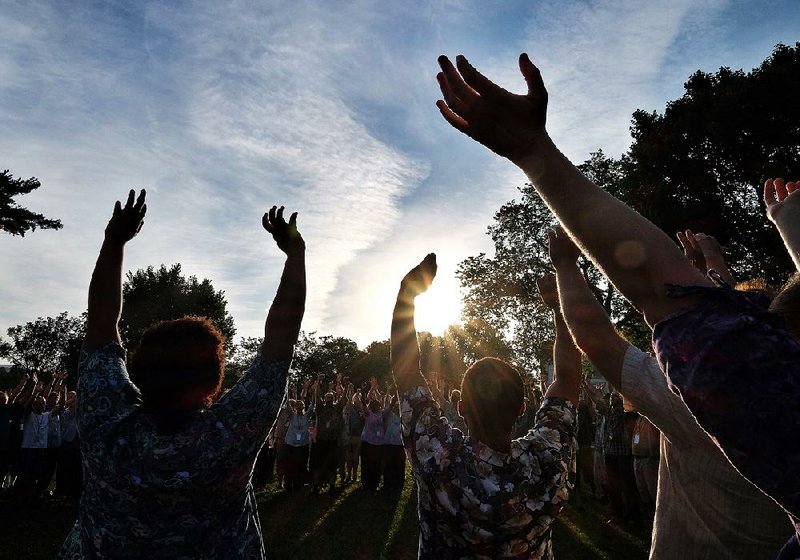 People attend a sunrise prayer service Saturday to kick off a 12-hour event called “Together” on the National Mall in Washington.