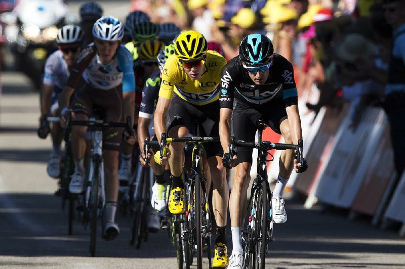 Britain’s Chris Froome (left) continued to keep the overall lead in the Tour de France after 15 stages. He leads Bauke Mollema by 1:47.