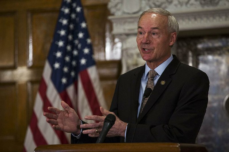 Governor Asa Hutchinson speaks to media during a press conference July 5, 2016.