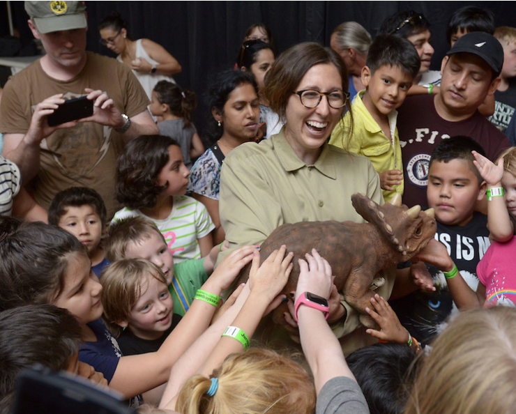 Children gather around to pet a baby triceratops held by Jessica Mahoney with Jurassic Quest during a Dinosaur Babies show on Saturday July 16, 2016 at Jurassic Quest at the Benton County Fairgrounds and Expo Center in Bentonville.