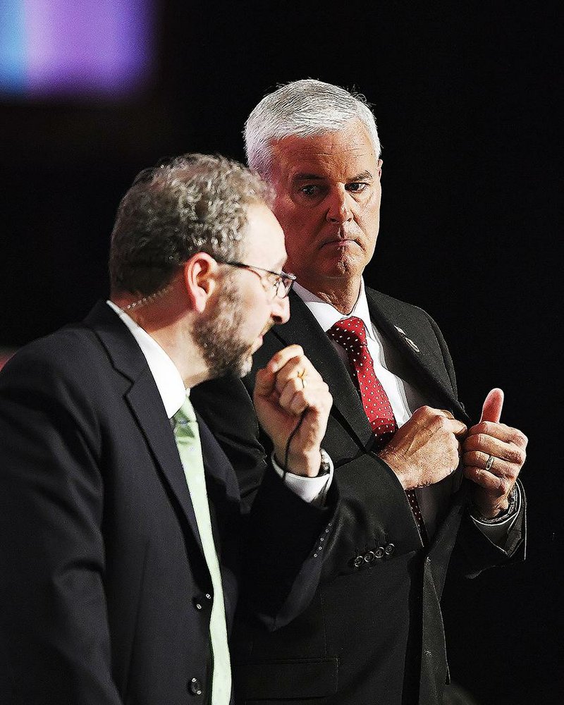 U.S. Rep. Steve Womack (right), R-Ark., confers with Hugh Halpern, staff director of the House Rules Committee, during the opening day of the Republican National Convention in Cleveland. Womack was in charge of the gavel when a dispute over convention rules broke out.