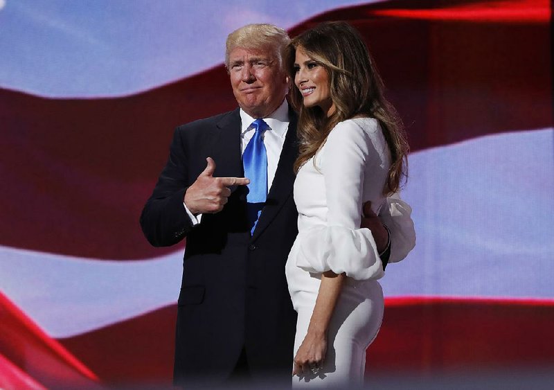 Republican presidential candidate Donald Trump greets his wife, Melania, after introducing her Monday during the Republican National Convention in Cleveland.