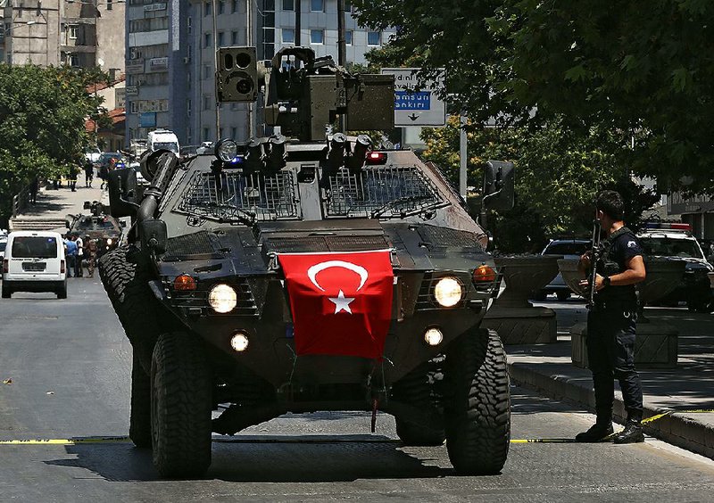 A Turkish police special forces vehicle arrives Monday in Ankara. The provincial governor’s office said a military officer was detained in the city after he fatally shot the driver of a vehicle that he hijacked.