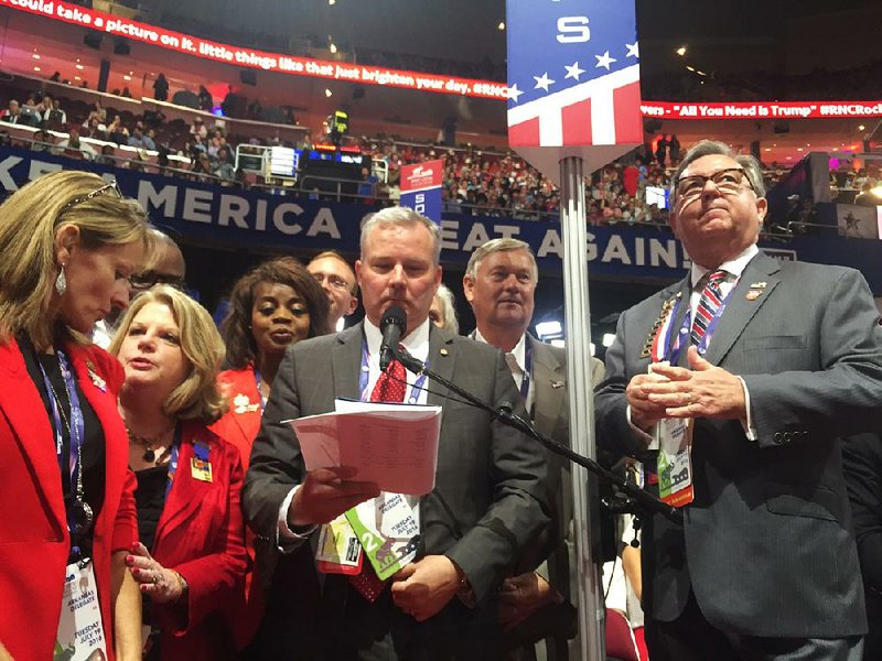 Lt. Gov. Tim Griffin gives the tally for Arkansas’ delegation Tuesday at the convention.