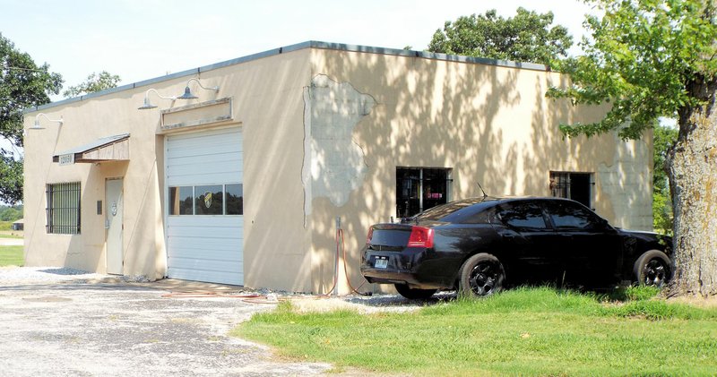 Photo by Randy Moll Highfill police department&#8217;s Dodge Charger, no longer running, was parked beside the city&#8217;s police department building, which also has problems with peeling walls, a leaky roof and mold.