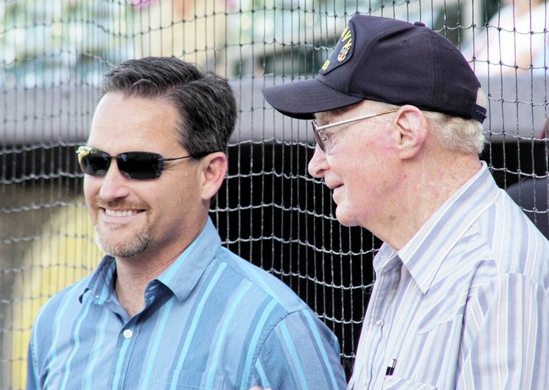 Photo by Randy Moll Kevin Johnston, Gentry&#8217;s mayor (left), visits with Burl Lyons before Lyons went to the mound to throw out the first pitch during Gentry Night at Arvest Ballpark on Wednesday, July 13.