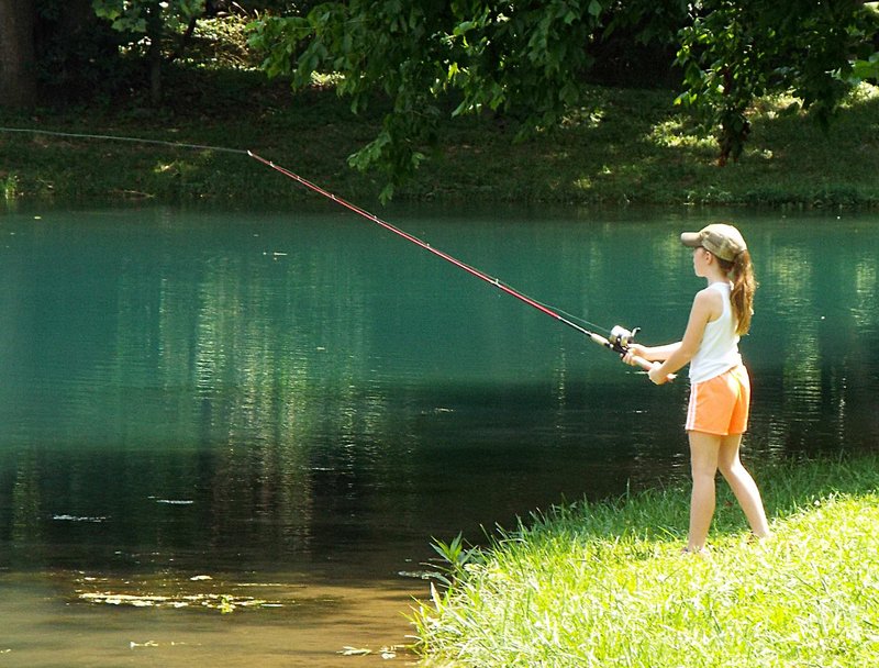 Photo by Randy Moll Hannah Hulsey, 8, spent the afternoon trying her luck at the fishing derby held Monday at the Flint Creek Nature Area.