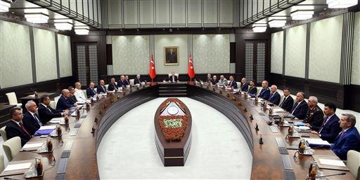 Turkey's President Recep Tayyip Erdogan, center, leads an emergency meeting of the National Security Council with Prime Minister Binali Yildirim, center left, Chief of Staff Gen. Hulusi Akar, center right, and ministers in Ankara, Turkey, on Wednesday, July 20, 2016. 