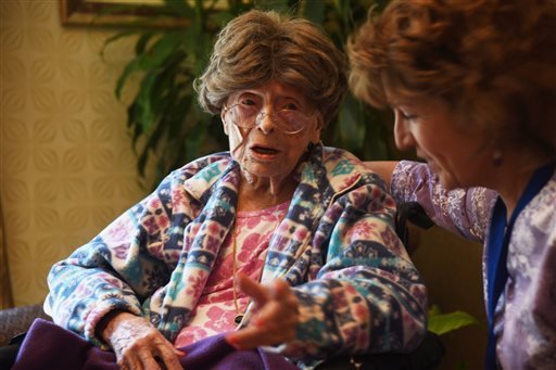 In this July 19, 2016, photo, Adele Dunlap, 113, talks with Susan Dempster, the activities director at Country Arch Care Center in Pittstown, N.J. 