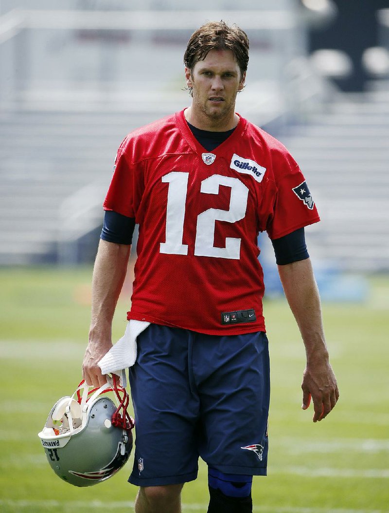 New England Patriots quarterback Tom Brady walks off the field following an NFL football practice Thursday, May 26, 2016, in Foxborough, Mass. 