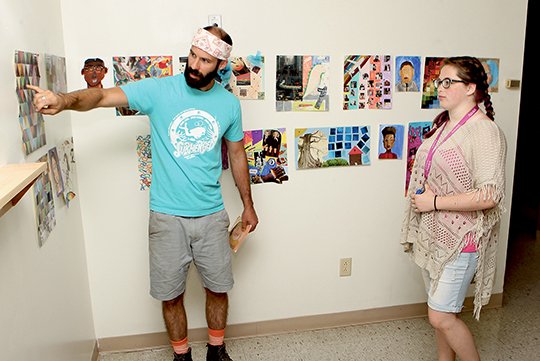 The Sentinel-Record/Richard Rasmussen DESIGN THINKING: ASMSA art instructor Brad Wreyford, left, discusses an art project with Shaelyn Chestnut, of Western Yell County, Thursday during the penultimate day of the Project HELIX camp. The school hosted more than 30 prospective rising sophomores for two weeks on campus.