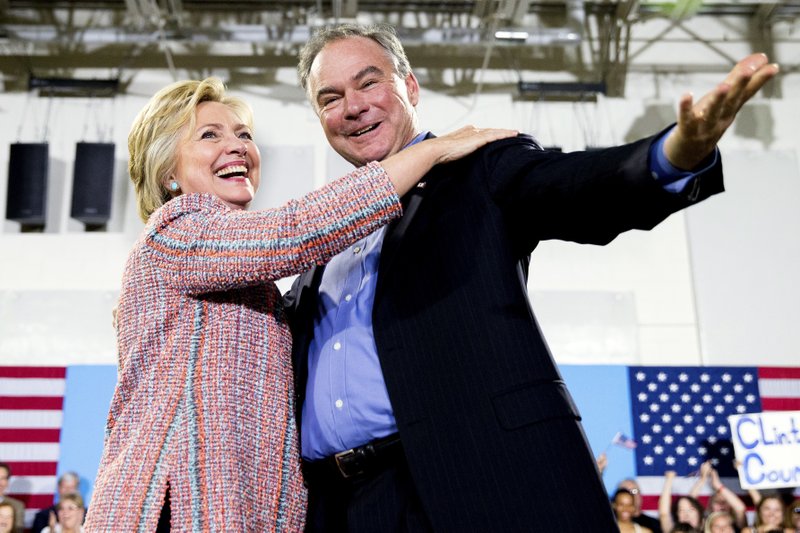 In this July 14, 2016, file photo, Democratic presidential candidate Hillary Clinton, accompanied by Sen. Tim Kaine, D-Va., speaks at a rally at Northern Virginia Community College in Annandale, Va. Clinton has chosen Kaine to be her running mate (AP Photo/Andrew Harnik)

