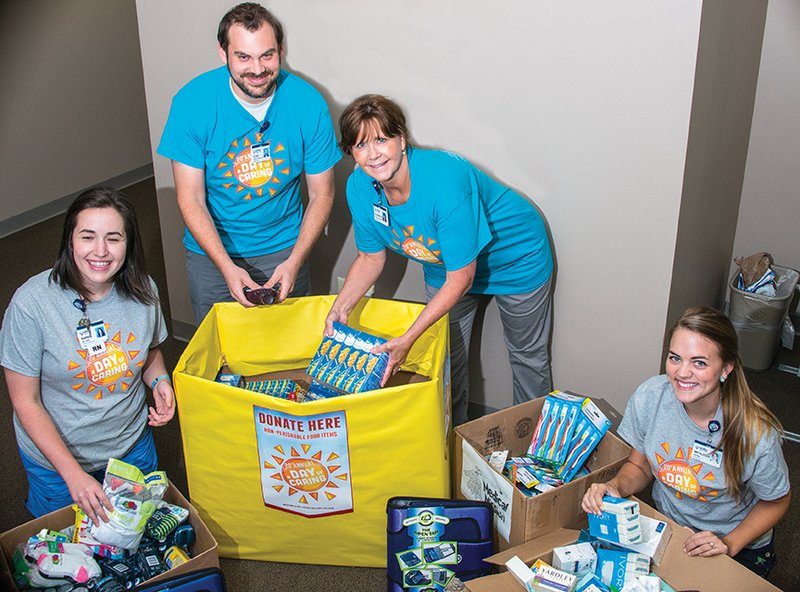 Preparing for Saturday’s A Day of Caring are Unity Health-White River Medical Center employees Karen Ball, registered nurse, from left; Clay Garrett, graphic-design coordinator; Elizabeth Leaver, marketing assistant; and Micaleigh Coleman, marketing intern. A Day of Caring will offer a variety of free medical exams, as well as school and personal-care supplies from 9 a.m. to noon Saturday at Harding Academy High School, 1529 E. Park Ave. in Searcy.