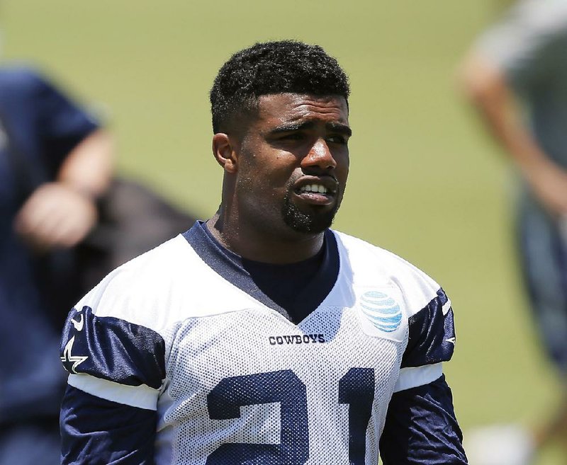 In this June 8, 2016, file photo, Dallas Cowboys running back Ezekiel Elliott walks off the field after a workout during an NFL football training camp in Irving, Texas. 