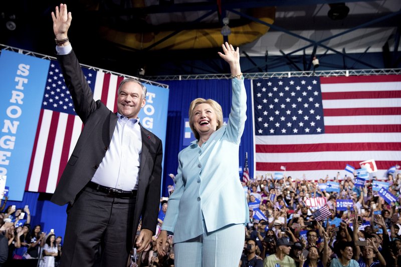 Democratic presidential candidate Hillary Clinton and Sen. Tim Kaine, D-Va., arrive at a rally at Florida International University Panther Arena in Miami on Saturday. Clinton has chosen Kaine to be her running mate. 