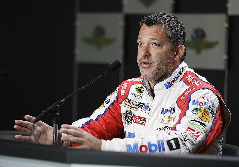 Sprint Cup Series driver Tony Stewart (14) responds to a question during a news conference for the Brickyard 400 NASCAR auto race at the Indianapolis Motor Speedway in Indianapolis, Friday, July 22, 2016. 