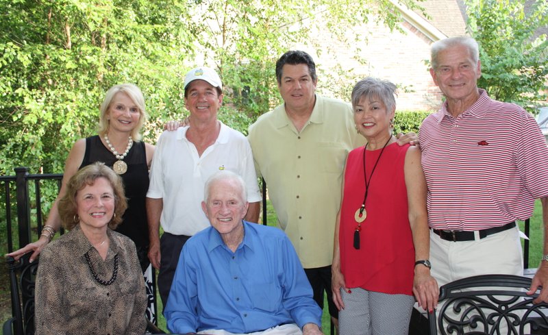 Gen and Frank Broyles (seated), Mary Bassett and Hank Broyles (standing, from left), Tom Pagnozzi and Caroline and Norm DeBriyn gather at An Evening with Pagnozzi Charities on July 9.