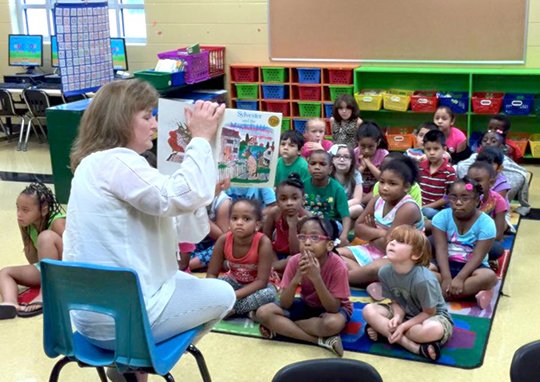 Hot Springs School Board member Ann Hill recently read to students during the district's K-4 Literacy Academy. Each guest read and shared a book with their young audience as part of the Garland County and Arkansas campaigns for grade level reading.
