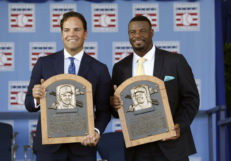 Mike Piazza (left) and Ken Griffey Jr., who combined to hit 1,057 home runs during their Major League Baseball careers, were officially inducted in the National Baseball Hall of Fame on Sunday.