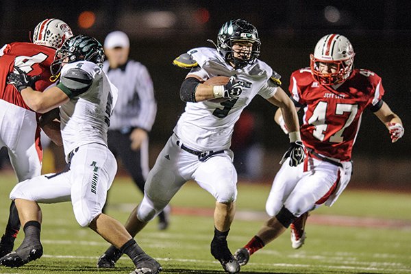 Rock Bridge's Hayden Johnson (9) takes the ball down the field during the game against Jefferson City in the Class 6, District 3 quarterfinals on Friday, Nov. 1, 2013, at Adkins Stadium in Jefferson City, Mo.