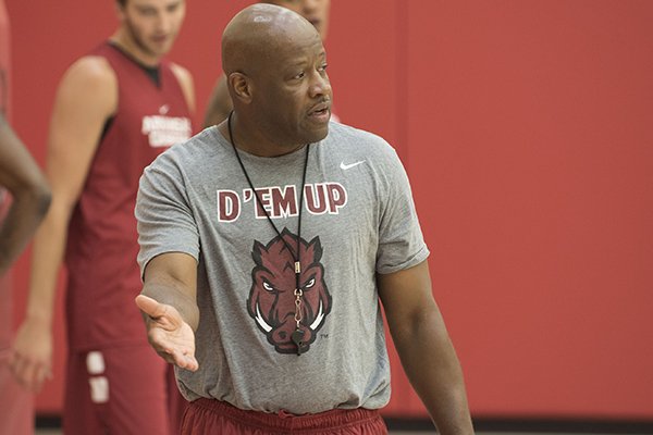 Arkansas coach Mike Anderson instructs players during practice Monday, July 25, 2016, in Fayetteville. 