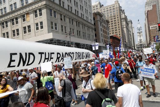 Demonstrators march in downtown Monday, July 25, 2016, in Philadelphia, during the first day of the Democratic National Convention.