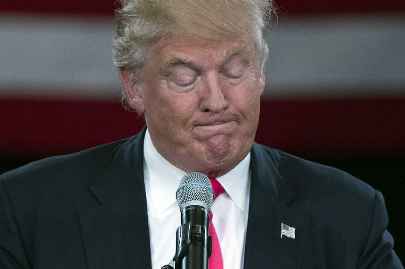 Republican presidential candidate Donald Trump pauses as he speaks during a town hall Monday in Roanoke, Va