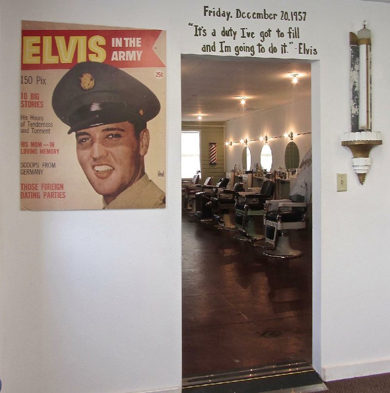 A magazine cover devoted to Elvis Presley is posted at the entrance to the Army barbershop at Fort Chaffee where the newly inducted rock star got his fi rst military haircut in 1958.