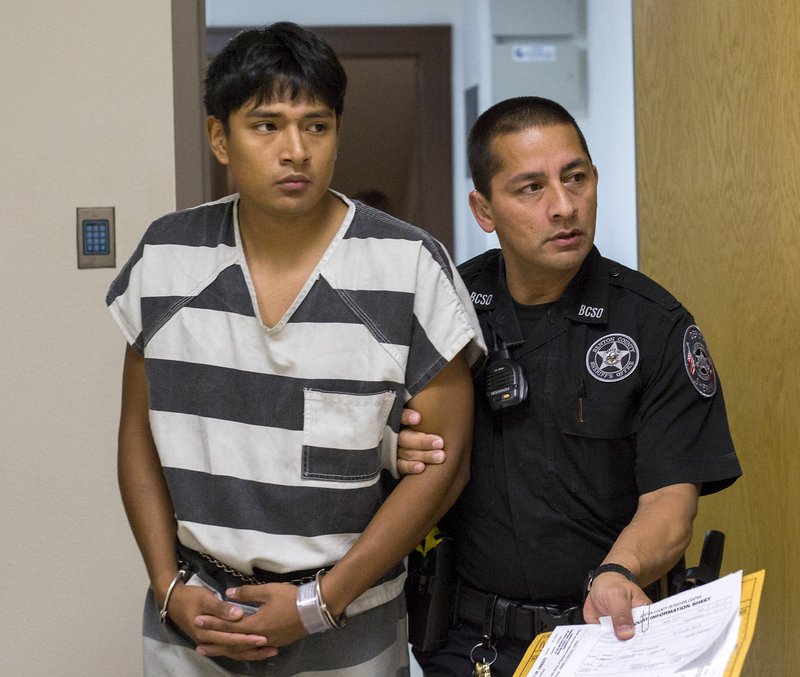  Edward Alexis Martinez-Torres is led from Circuit Judge Robin Green&#8217;s courtroom on June 20 at the Benton County Courthouse in Bentonville. Martinez-Torres is accused of killing a 3-month-old boy.