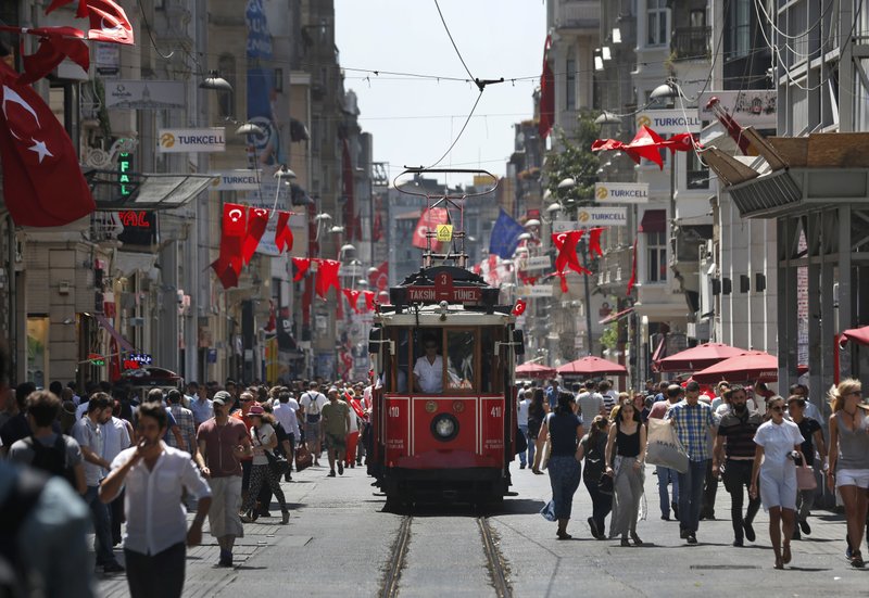 People walk in central Istanbul's Istiklal Avenue, the main shopping road of Istanbul, Monday, July 25, 2016. 