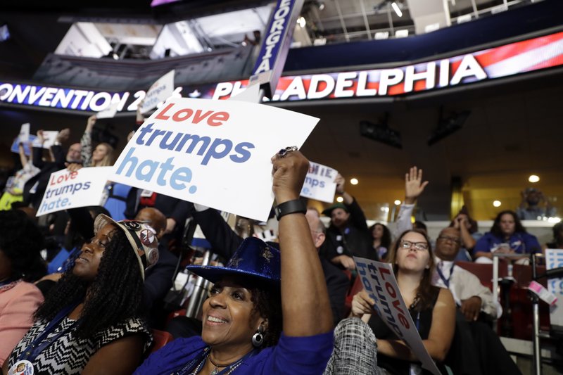 Georgia delegate Pat Pullar holds up a sign during the first day of the Democratic National Convention in Philadelphia , Monday, July 25, 2016. 