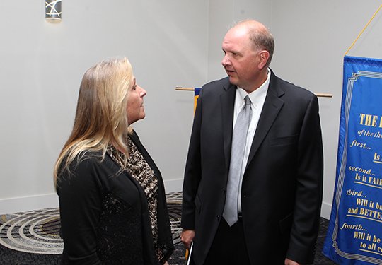 The Sentinel-Record/Richard Rasmussen OAKLAWN ROTARY: Oaklawn Rotary Club President Candice Young, left, speaks with Hot Springs Police Chief Jason Stachey prior to the club's weekly meeting at The Hotel Hot Springs & Spa on Monday.