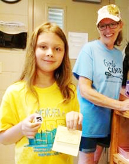 Submitted photo SPARKLING DISCOVERY: Grace Houston, 9, of Missouri, shows her find of a 1.53-carat diamond at Crater of Diamonds State Park, while her grandmother, Nancy Meli, looks on.