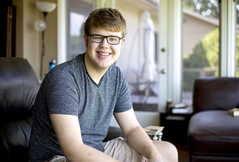 NWA Democrat-Gazette/JASON IVESTER Roy McKenzie, 17, pictured Friday, excelled in his advanced placement studies and graduated from Prairie Grove High a year early. He will spend what would have been his senior year living in Spain before beginning college back in the United States.