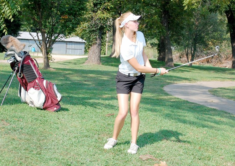 Graham Thomas/Herald-Leader Siloam Springs junior Brinkley Beever watches a shot during a golf match last season. Beever is among the top players for the Siloam Springs girls golf team heading into the 2016 season.