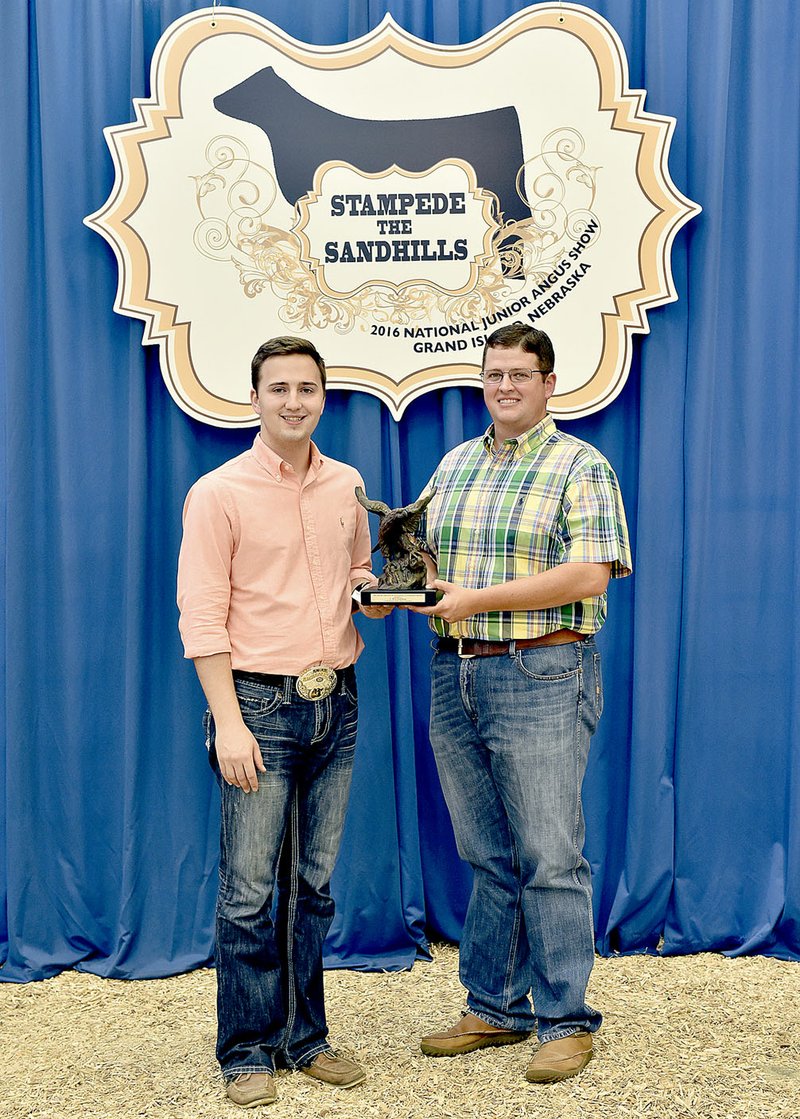 Will Pohlman of Prairie Grove, left, received the Jim Baldridge Outstanding Leadership Award at the 2016 National Junior Angus Show awards ceremony, July 8 in Grand Island, Neb. Pictured presenting the award is Jake Tiedeman.