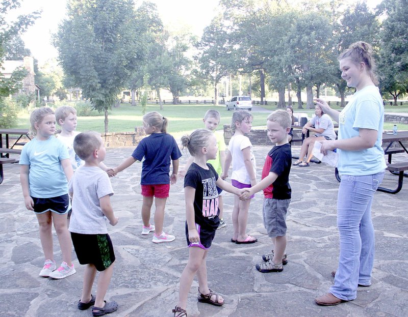 LYNN KUTTER ENTERPRISE-LEADER Halos &#8216;N Horns square dance group practices last week outside the Latta Barn at Prairie Grove Battlefield State Park. The group is one of many groups preparing for the square dance exhibitions and competitions during the Clothesline Fair over Labor Day weekend. Children in this group are 6- and 7-year-olds and have been together for three years. They practice once a week. Dancers are Avery Beare, Aubrey Wootton, Brynnah-Kayte McKnight, Braydon Burgess, Burkeley Calvert, Tripp Johnson, Haddon Hunt and Gage Calvert. Caller is Trinity Hignight.