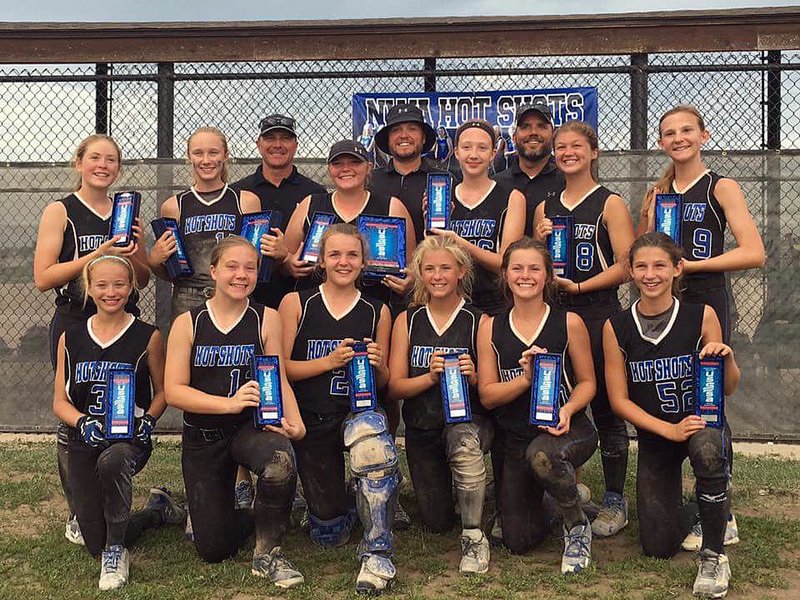 COURTESY PHOTO The NWA Hot Shots 03, a 12-under softball team comprised of players from Farmington, Elkins, Lincoln and Prairie Grove, finished runner-up out of 33 teams at the USSSA Midwest National Championship in Kansas City this past weekend. Pictured, at front, from left, are Lauren Rogers, Emma Rogers, Karoline McConnell, Sydney Stearman, Remington Adams and Ryleigh Landrum. On the second row, from left, are Brianna Crowley, Carson Griggs, Madie Hutchinson, Drew Clifford, Brooklyn Haney and Allie Devecsery. At back, are coaches Brad Griggs, Eric Crowley and Mike McConnell.