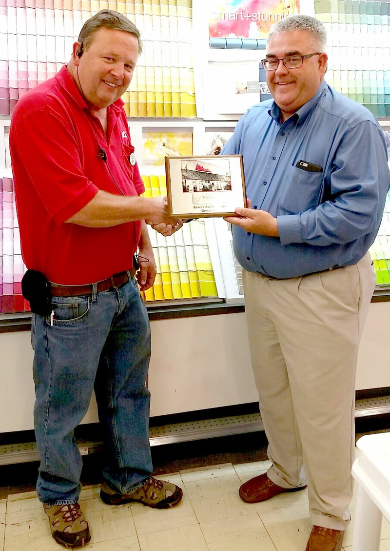 Submitted Photo Randy Bever (left) received the Platinum Performance Retailing designation earlier this month from Patrick Bride, regional manager for Ace Hardware.