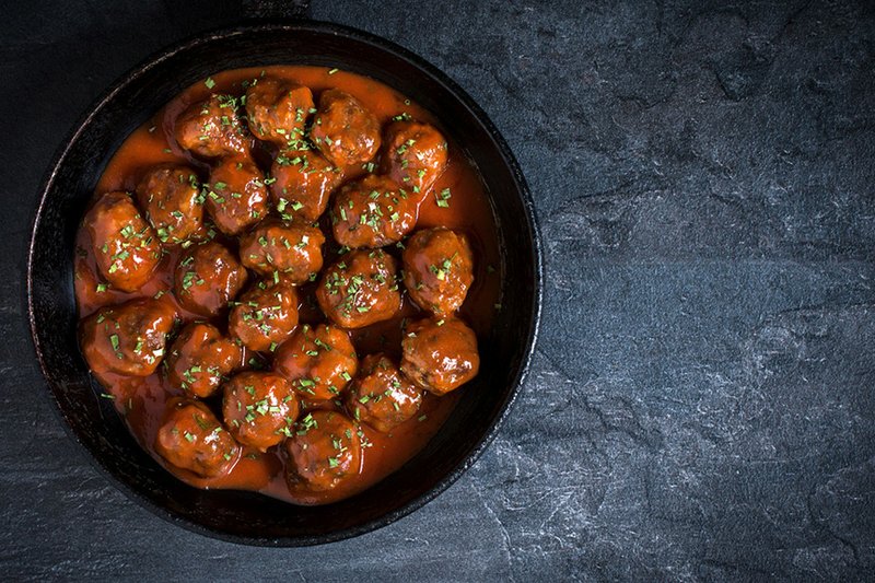 These hearty meatballs are simmered in tomato sauce before serving.