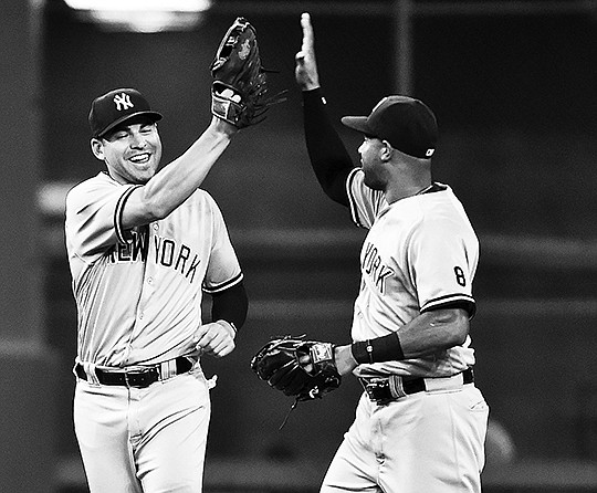 The Associated Press THAT'S A WINNER: Yankee outfielders Jacoby Ellsbury, left, and Aaron Hicks celebate New York's 2-1 victory over the homestanding Houston Astros Monday night. It was the Yankees' first game since trading reliever Aroldis Chapman to the Chicago Cubs.