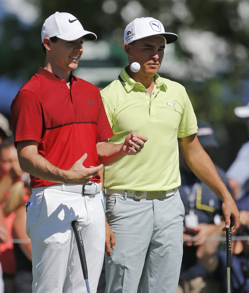The Associated Press MAJOR LEAGUE: Rory McIlroy, left, talks with Rickie Fowler during a practice round for the PGA Championship Tuesday at Baltusrol Golf Club in Springfield, N.J. Two of McIlroy's four major titles (2012, 2014) have come in the PGA.