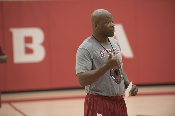 Arkansas coach Mike Anderson talks to players during practice Monday, July 25, 2016, in Fayetteville. 