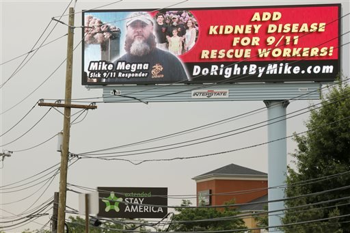 This Thursday, June 23, 2016, photo shows a billboard rented by Mike Megna, that includes Megna's name and picture as well as a plea asking for kidney disease to be added to the list of covered conditions by a fund to help Ground Zero workers with health problems. 