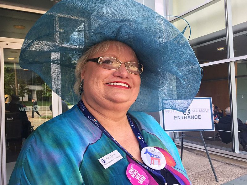 Karen Garcia, secretary of the Democratic Party of Arkansas, shows off one of her hats Wednesday in Philadelphia.