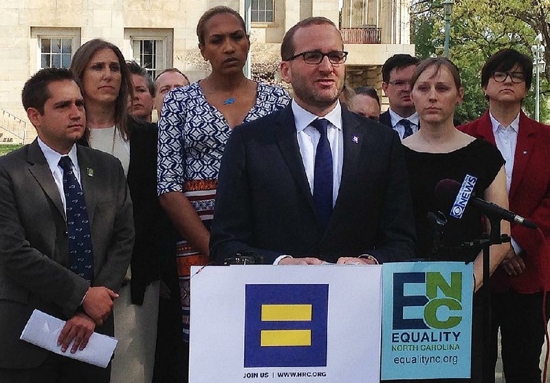  Human Rights Campaign president Chad Griffin, center, speaks at a news conference at the old state Capitol Building in Raleigh, N.C. on Thursday, March 31, 2016. 