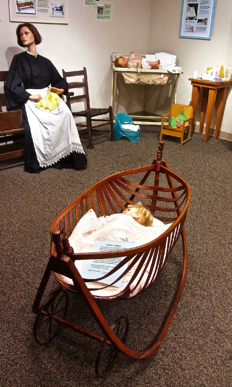 Displayed at Old Independence Regional Museum in Batesville is an antique field cradle on wheels. While doing farm work, a mother would pull it along with her baby inside. 