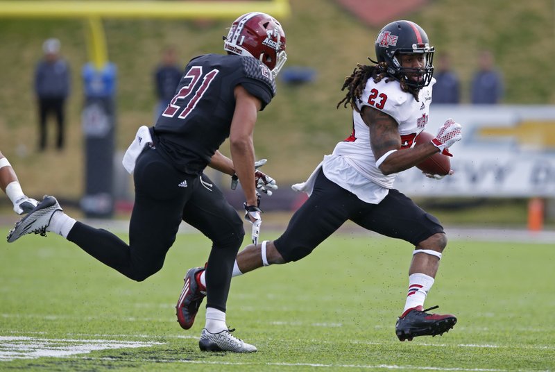 Arkansas State wide receiver J.D. McKissic (23) picks up a first down as he sprints past New Mexico State defensive back Jaden Wright during the first half of a game in Las Cruces, N.M., on Saturday, Nov. 28, 2015. 
