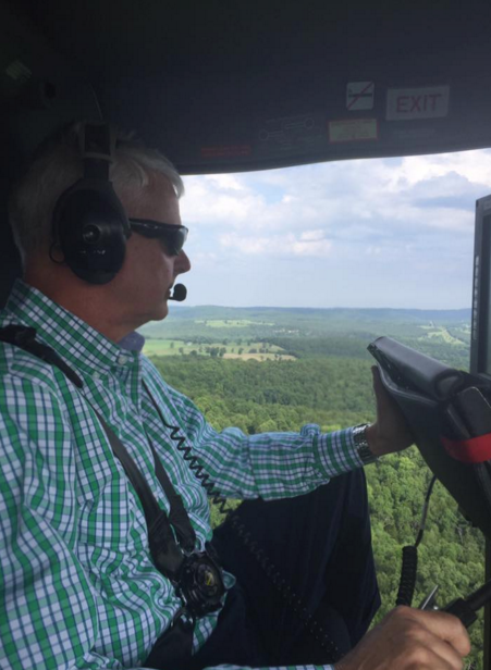This photo posted on Facebook by U.S. Rep. Steve Womack, R-Arkansas, shows the congressman on a helicopter during a marijuana eradication effort by the Arkansas National Guard and Boone County Sheriff's Office.